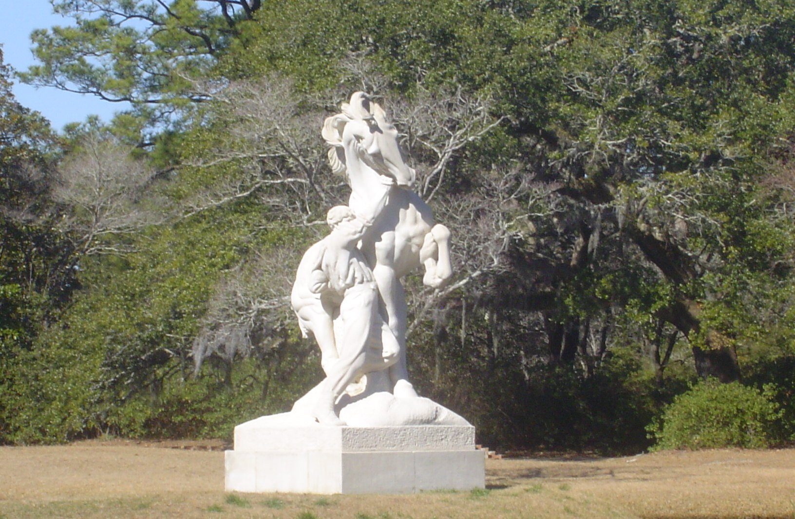 Marble figurative sculpture among trees at Brookgreen Gardens