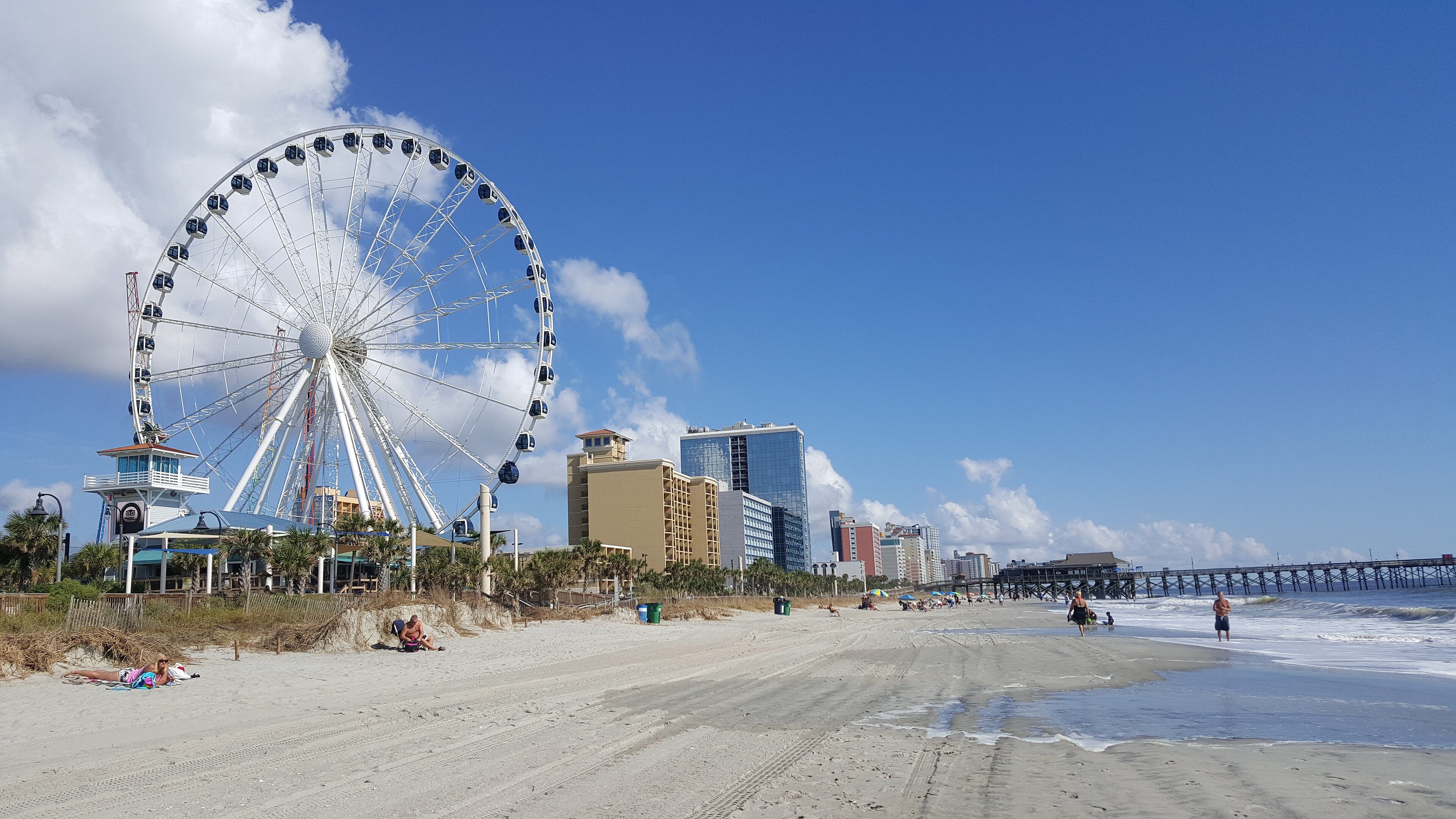 The SkyWheel Ferris wheel rising above the sand in Myrtle Beach